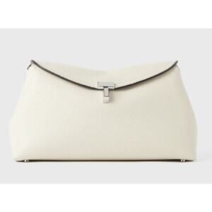 Sculptural TOTEME clutch bag named T-lock after the silver metal twist lock